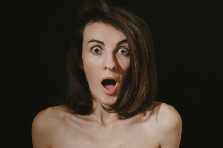 a woman with a surprised look on her face
