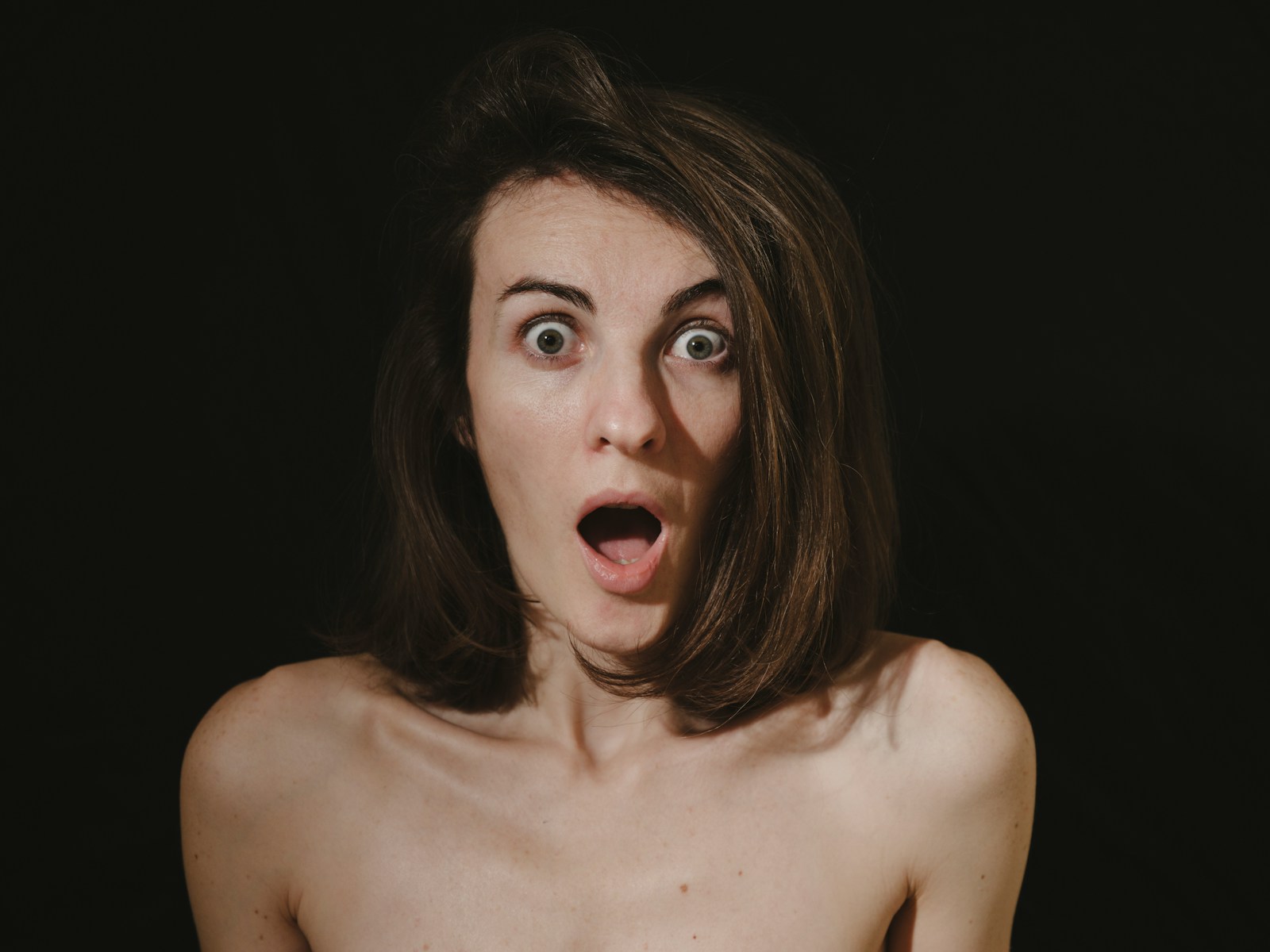 a woman with a surprised look on her face